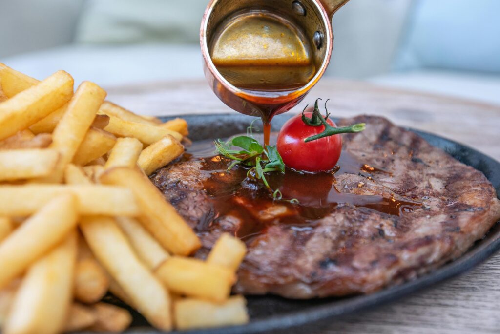 Sliced beef steak with a juicy, medium-rare interior